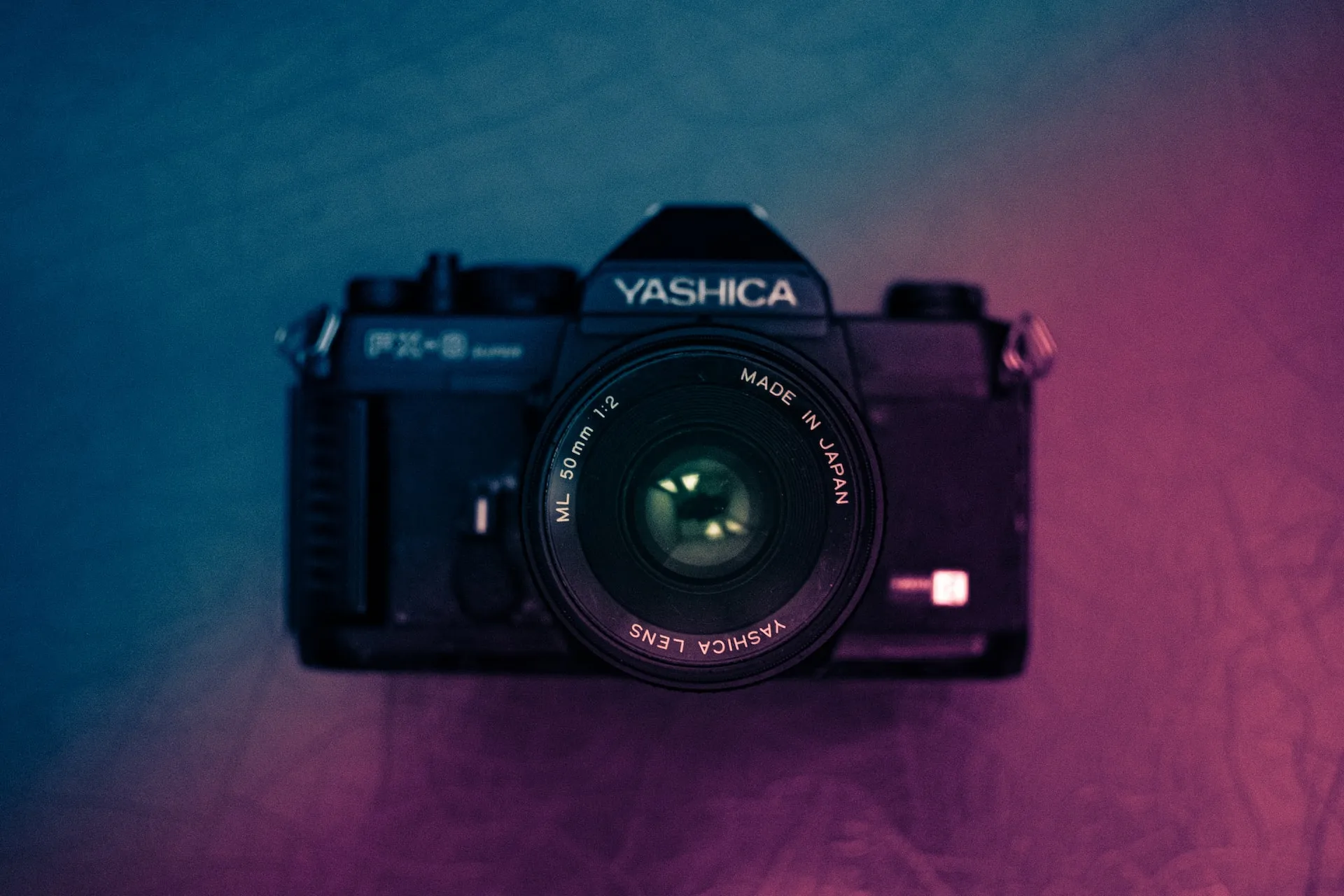 Camera on gradient background